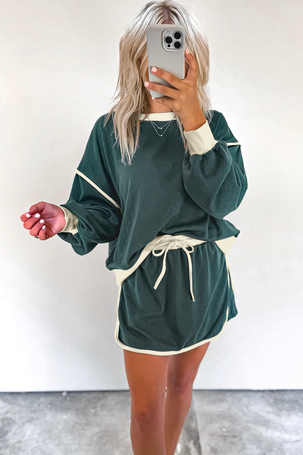 evergreen color contrast loose pullover and lace-up waist skort set