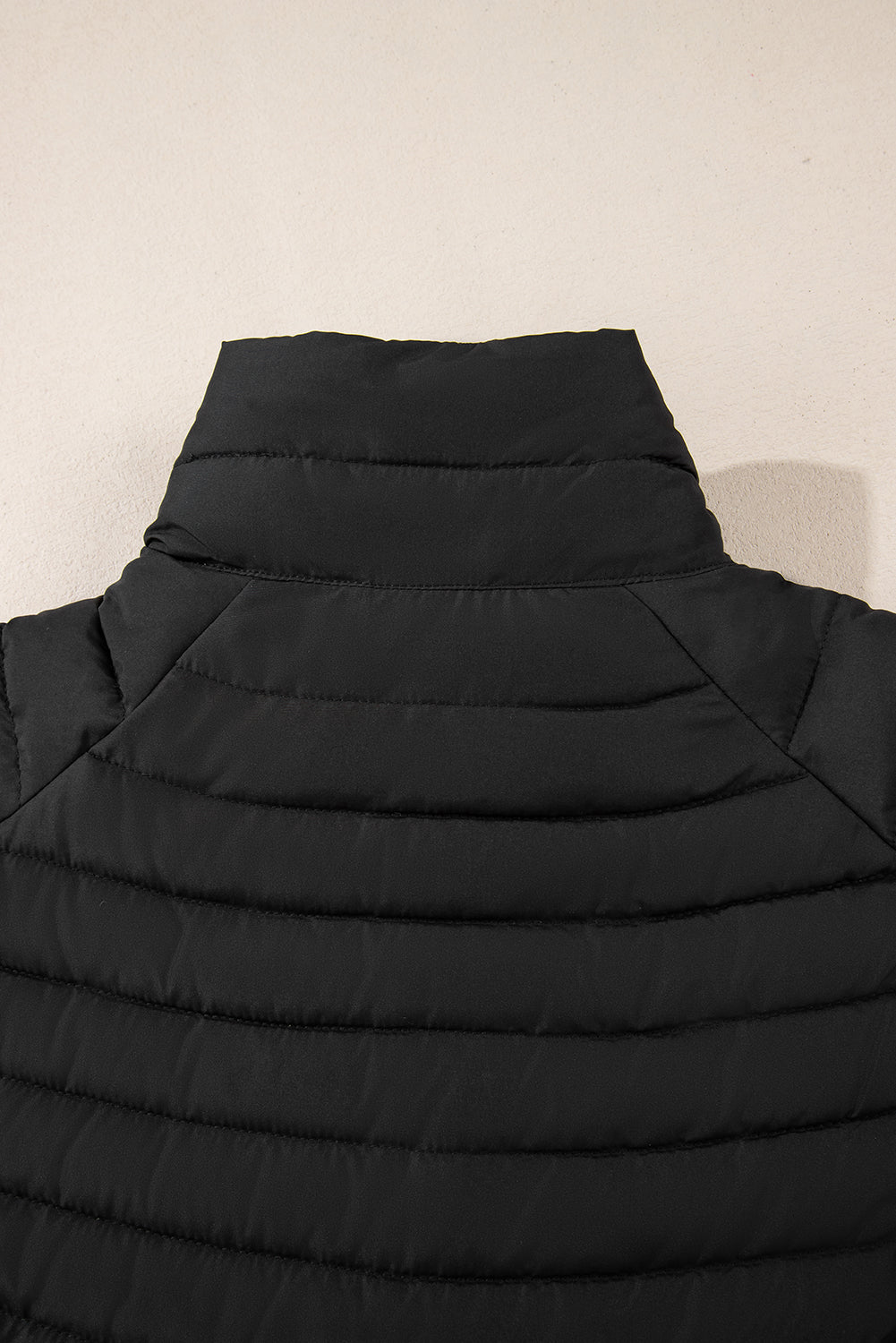 black solid color quilted zip-up puffer jacket