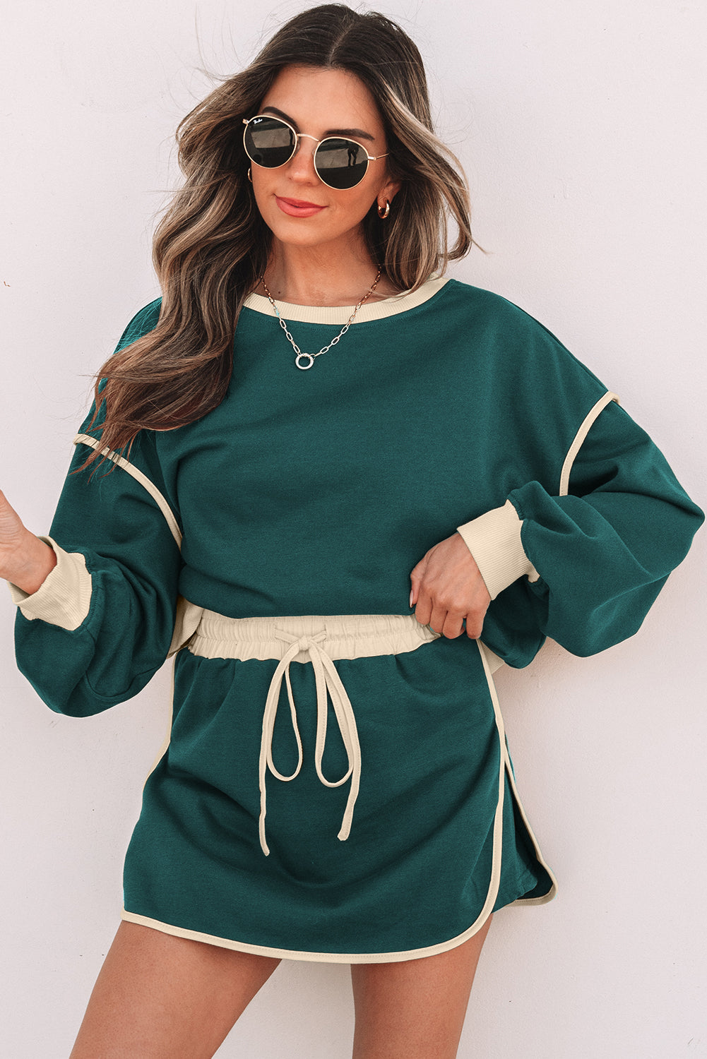 evergreen color contrast loose pullover and lace-up waist skort set