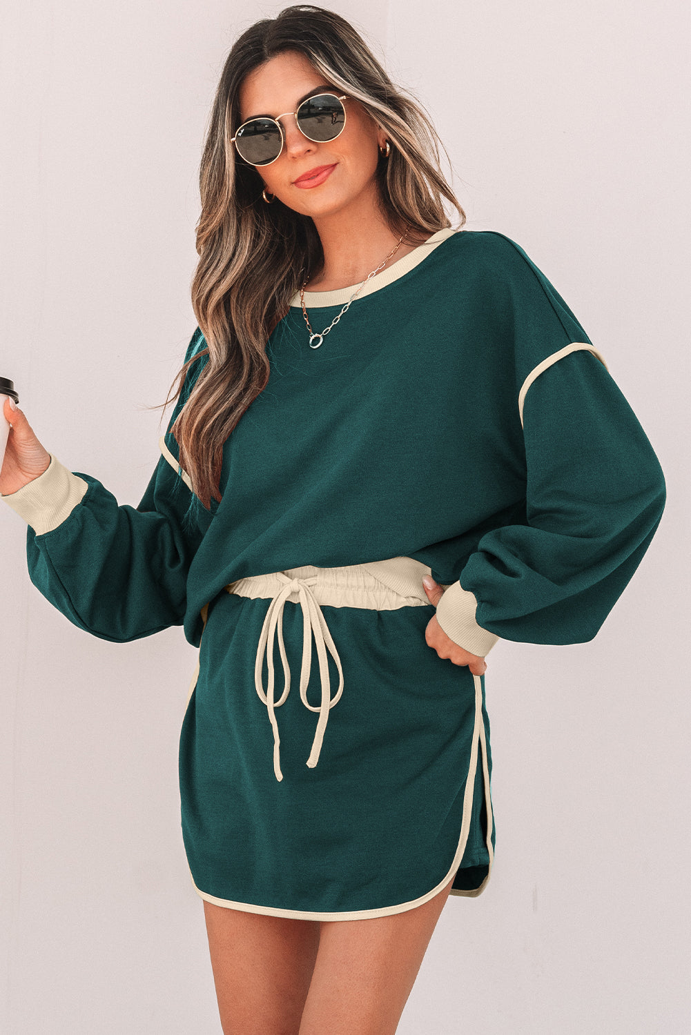 evergreen color contrast loose pullover and lace-up waist skort set