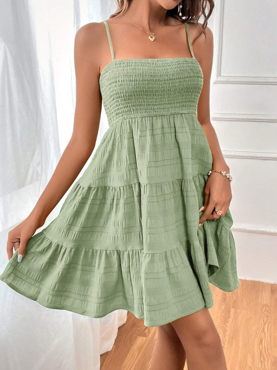 smocked tiered sleeveless mini dress