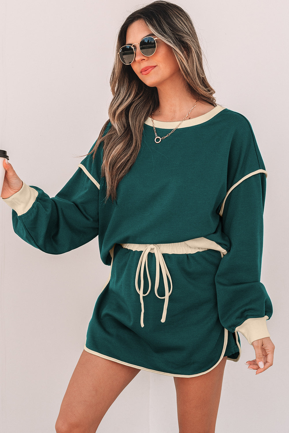 evergreen color contrast loose pullover and lace-up waist skort set