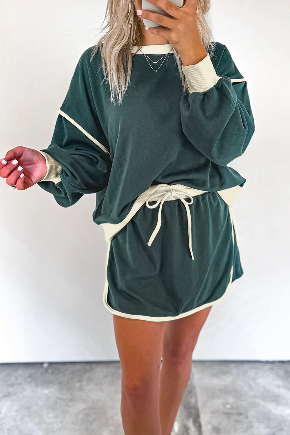evergreen color contrast loose pullover and lace-up waist skort set